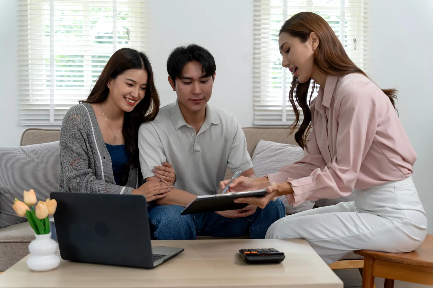 Advisor discussing asset protection strategies with a couple to safeguard long-term financial stability
