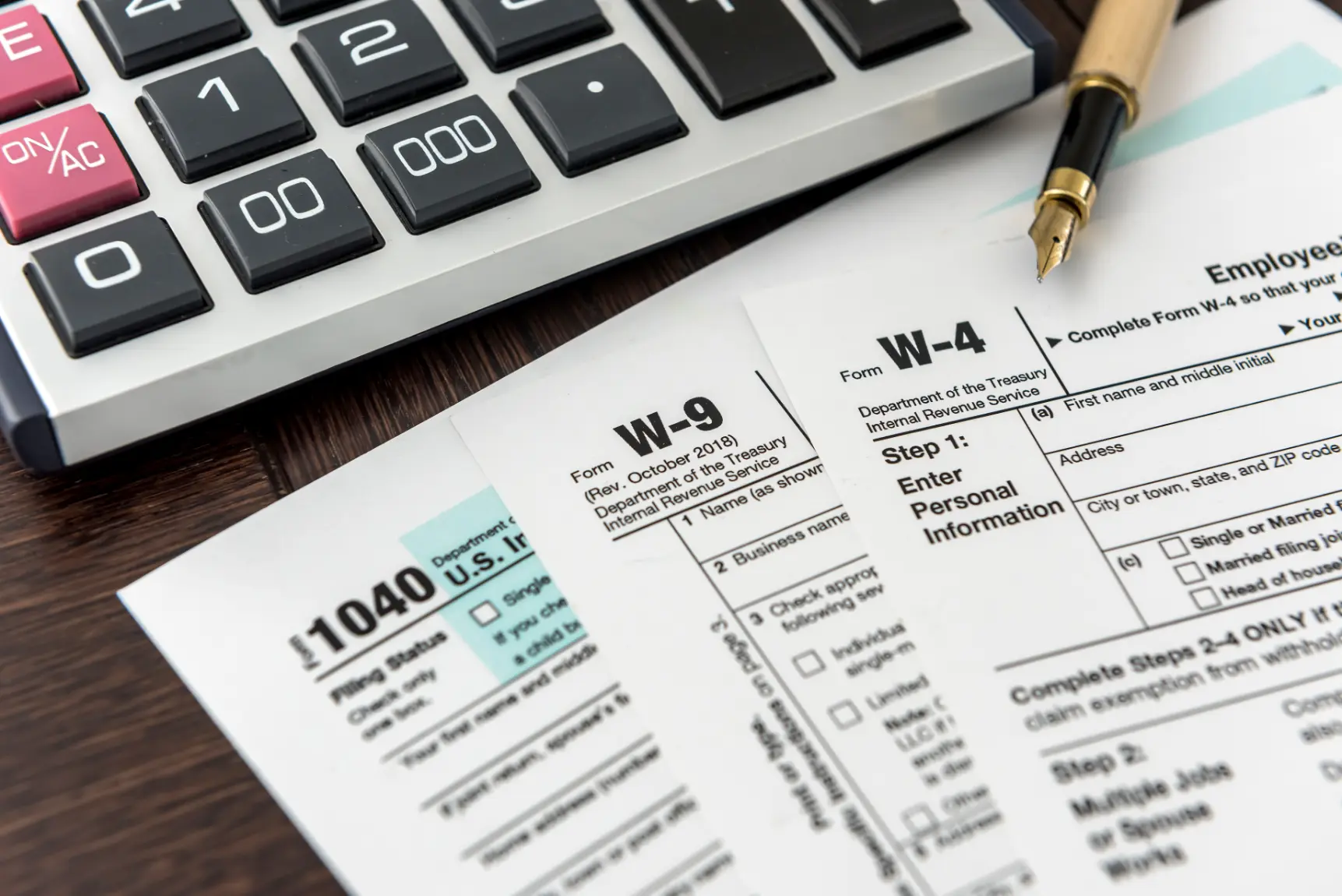 Calculator and financial documents with a pen illustrating equity growth and tax strategy planning